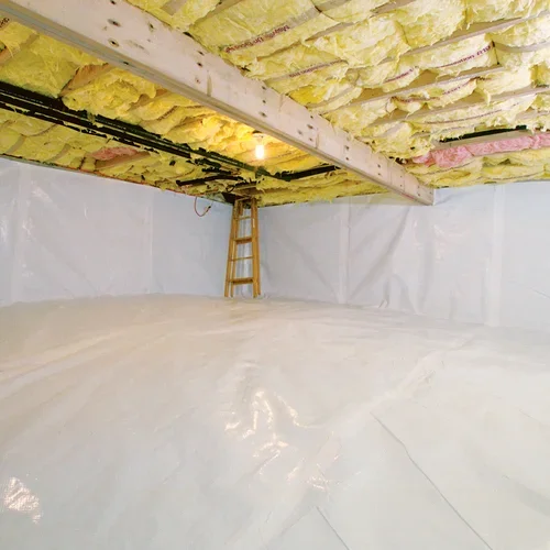 Yellow fiberglass insulation batts installed in crawlspace with white vapor barrier